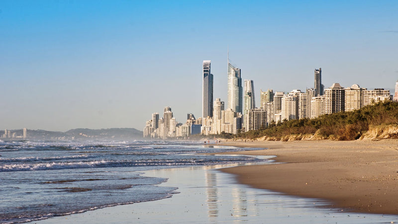 high-rise buildings of surfers paradise seen from a sandy beach