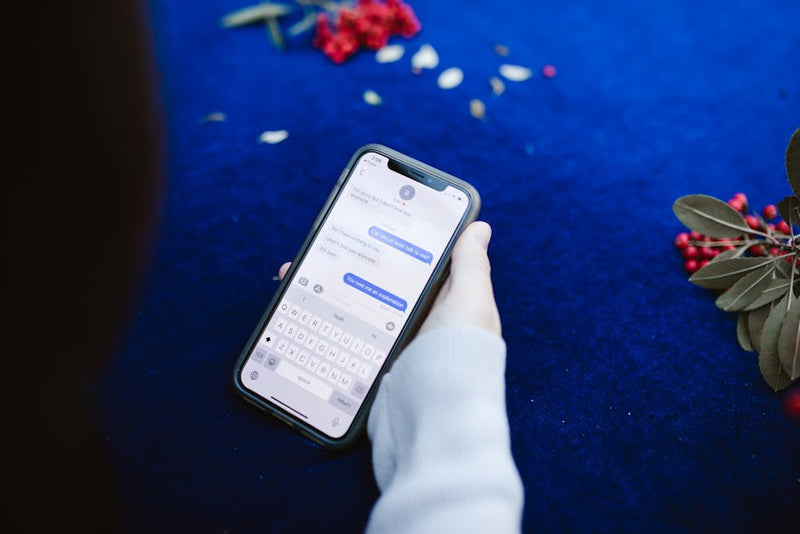 phone screen showing suspicious social media message scam warning