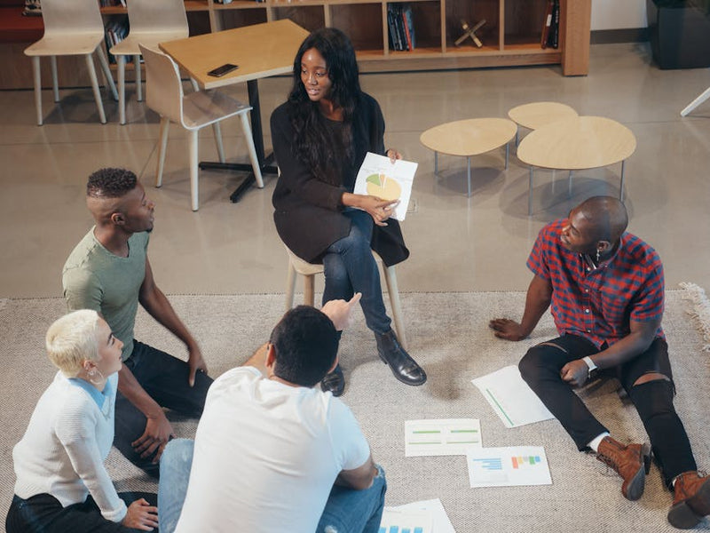 group of young people at community workshop in modern coworking space